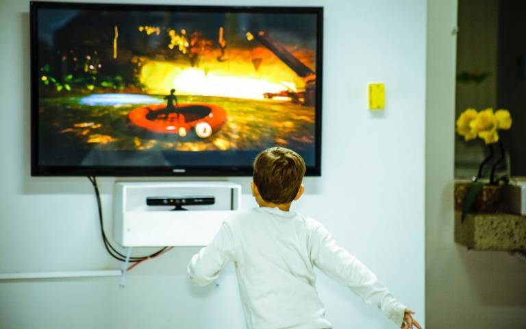 an image of a boy playing a video game