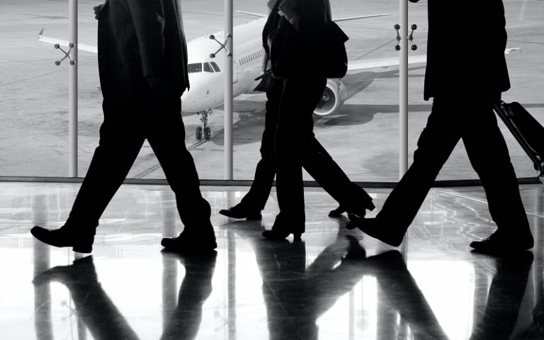 Business people walking through an airport