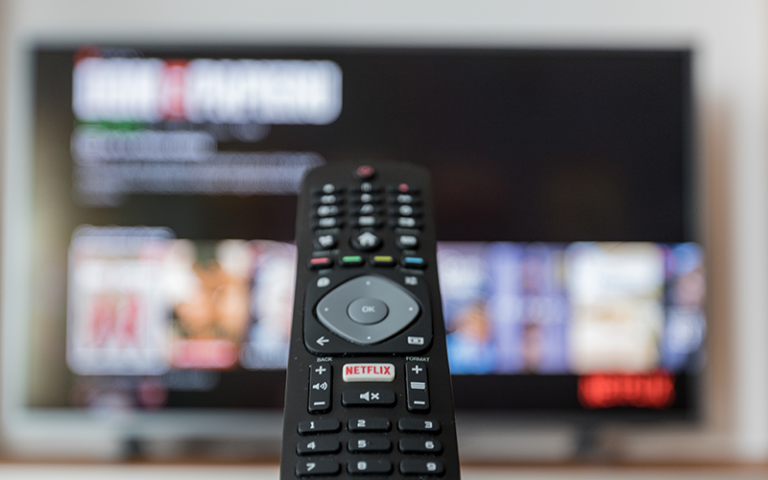 an image of a remote control pointing at a TV