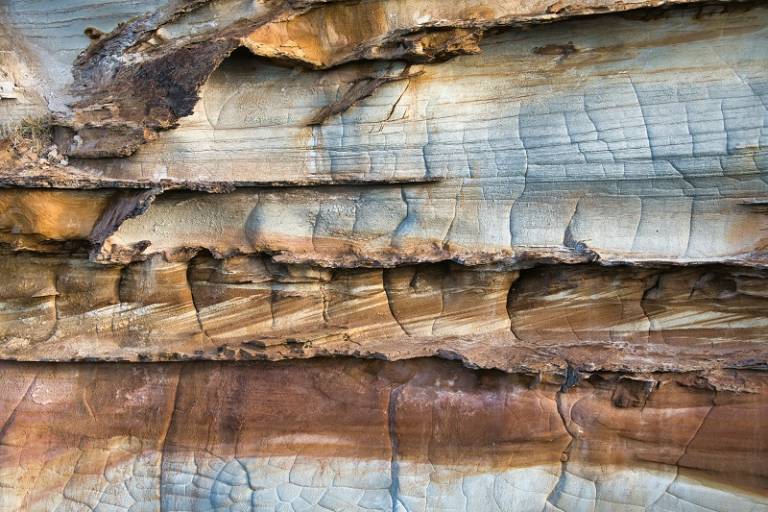 a close up of a rock face, Photo by Phillip Flores on Unsplash