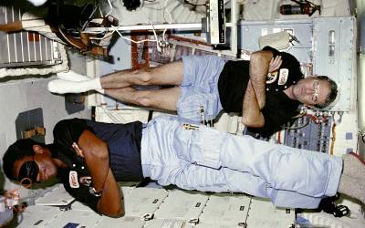 Commander Truly and Mission Specialist (MS) Bluford sleep on middeck, img credit nasa.gov