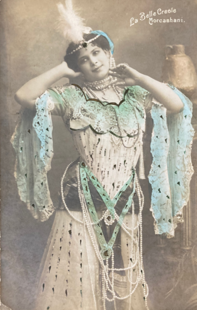 An old image of Morcashani the performer, wearing a twentieth century-style dress
