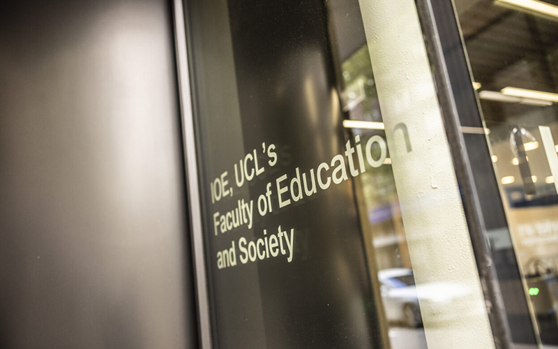 Text of the IOE building against a window. Image credit: Mat Wright for UCL IOE.