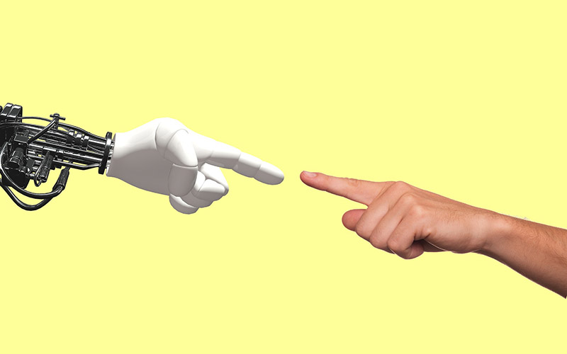 Human and robot fingers reaching to each other