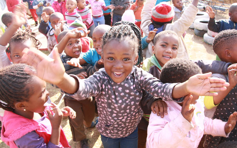 Smiling girl among group of children