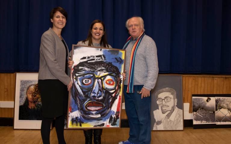 Andria Zafirakou, Becky Francis and Michael Attenborough with pupil's artwork