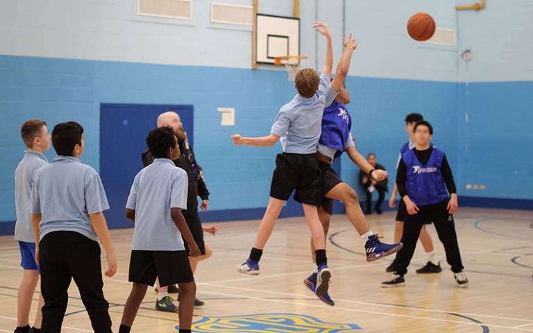 Boys playing basketball in school gymnasium (Photo: Phil Meech for UCL Institute of Education)