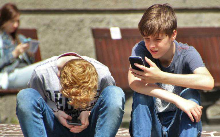 Boys on mobile phones