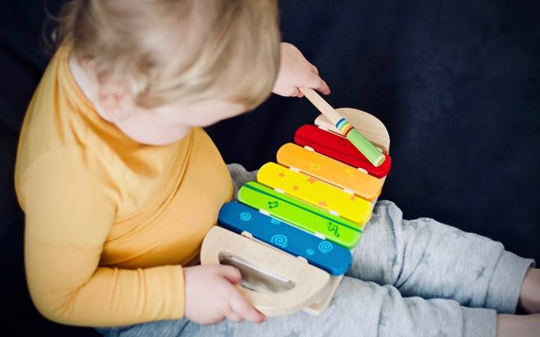 Child playing a xylophone