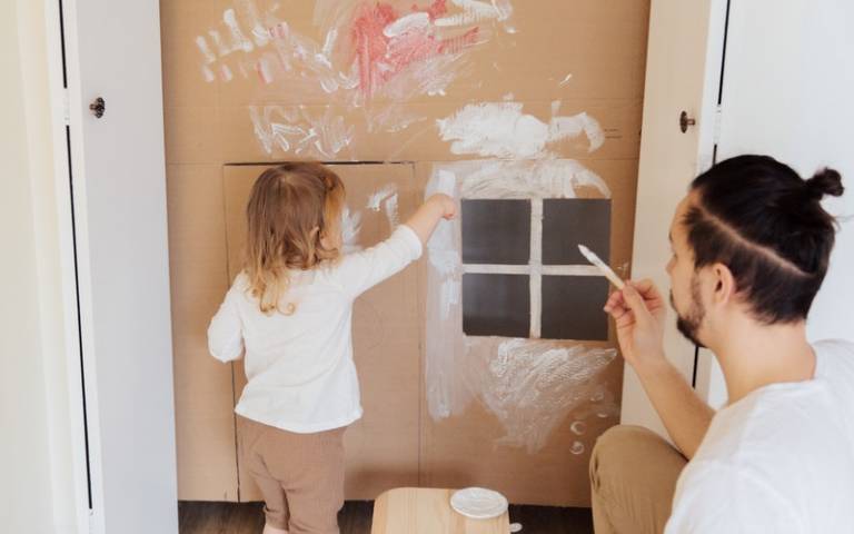 Child painting on cardboard. Image: Tatiana Syrikova via Pexels