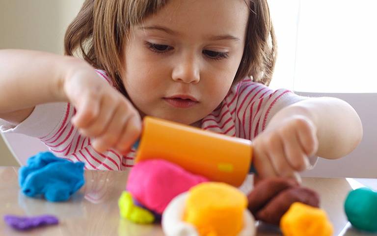 Child playing with modelling clay