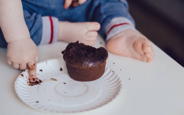 Child with muffin