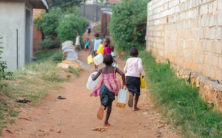 Children running in Uganda