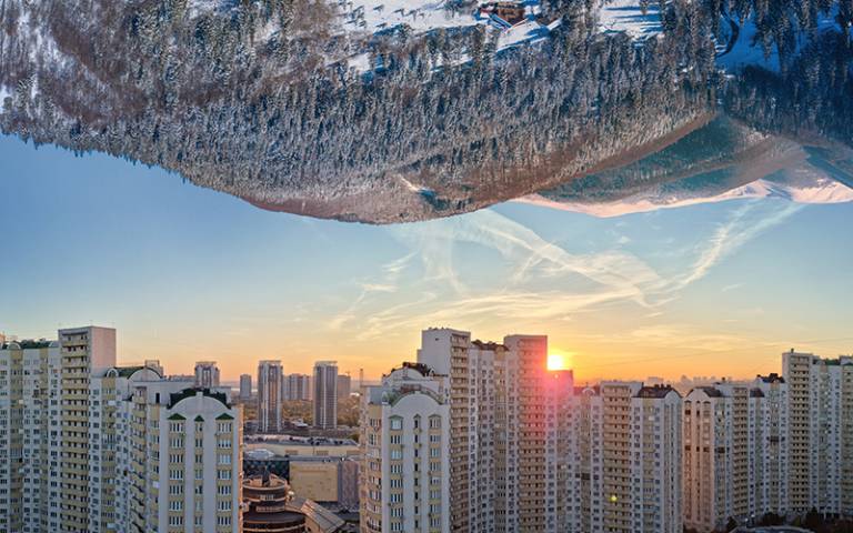 Beautiful mountain landscape from one side and city laldscape from other. Conceptual picture of relationships between cities and nature. Credit: Volff/Adobe Free Stock.