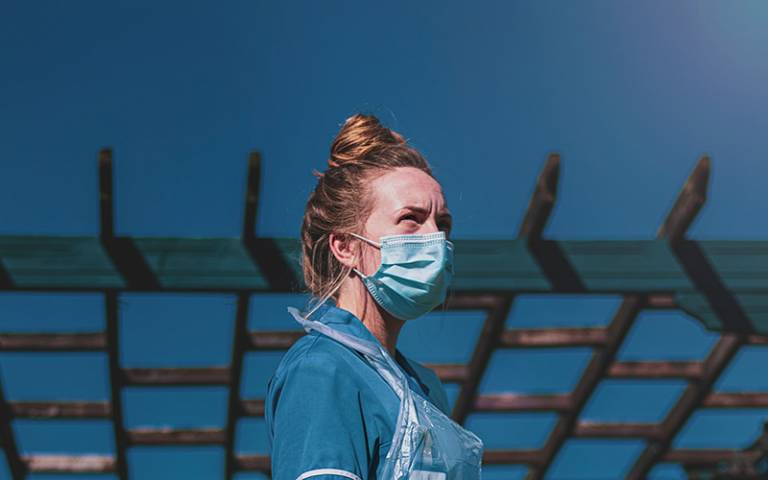 Care worker wearing mask. Image: Luke Jones via Unsplash