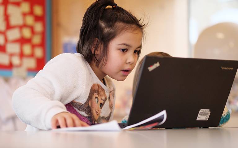 Girl using educational apps in early years and primary school