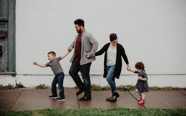 Family walking down the street. Image: Emma Bauso via Pexels