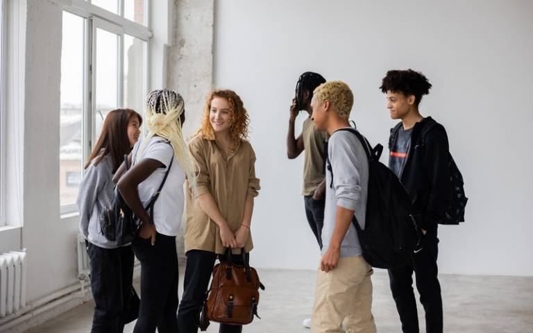 A diverse group of young people standing together. Image: Monstera via Pexels