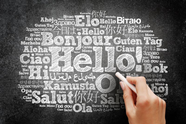 Hello word cloud in different languages of the world, education business concept on blackboard. By dizain, Adobe stock.