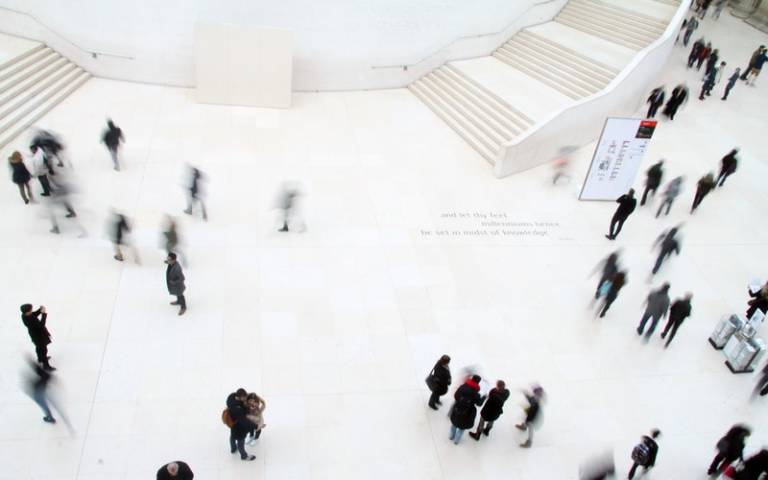 High angle photo of people walking on the ground. Image: sl wong via Pexels