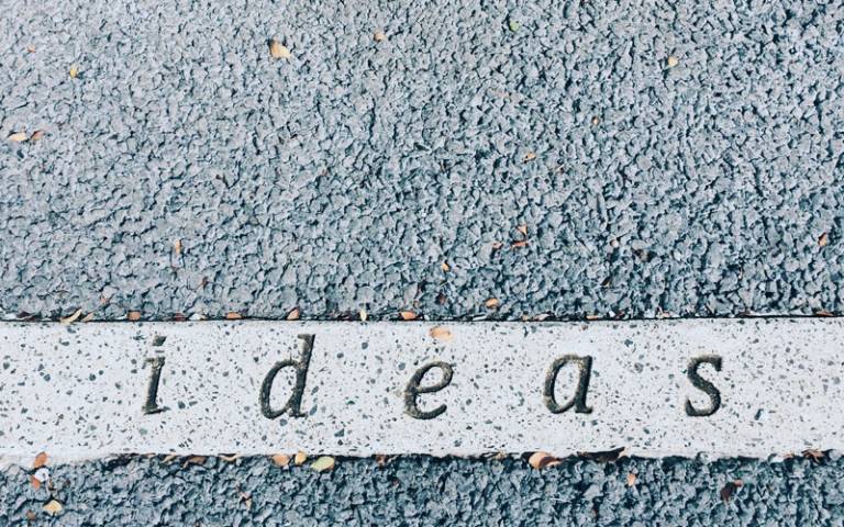 Ideas carved on concrete surface. Photo by Juan Marin on Unsplash