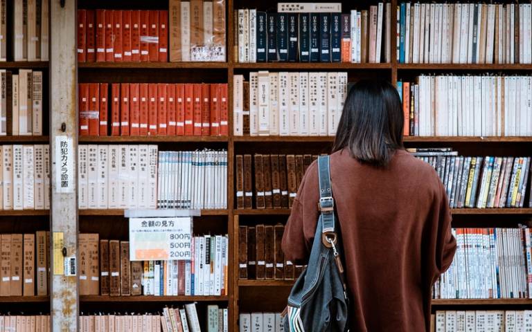 Student reading in a library in Japan. Image: Abby Chung via Pexels