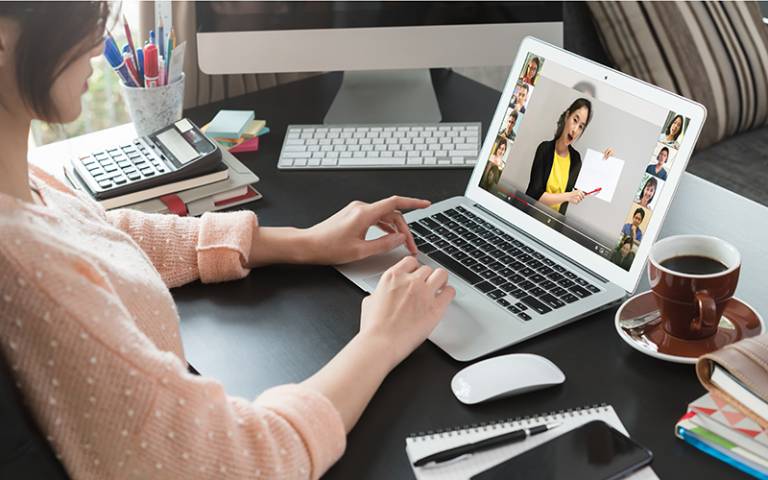 Online course attended by a woman at home. Image by stnazkul / Adobe Stock.