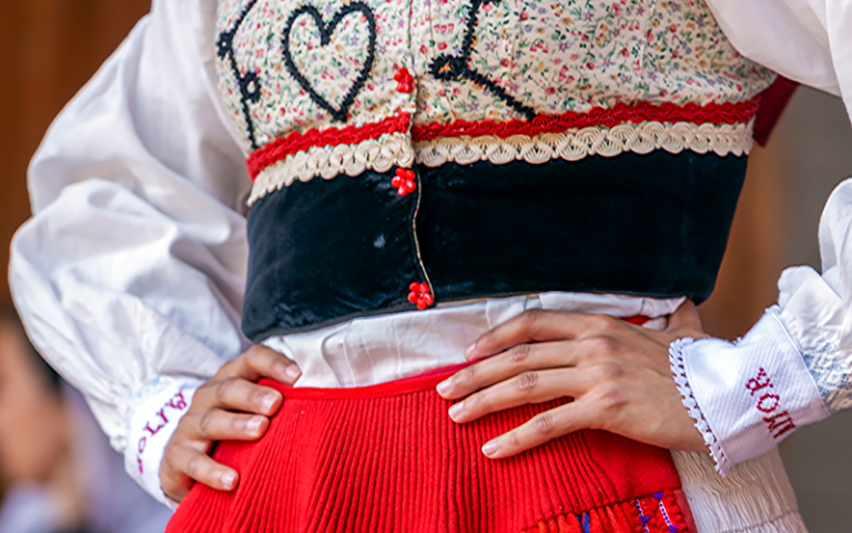 Woman's waist in traditional Portuguese dress. Credit: Florin / Adobe Stock