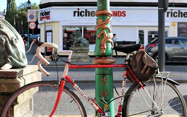 Bicycle rests on Chinese decorated lamp post in London. Image: Sofia Gomez Millington, China at Home category