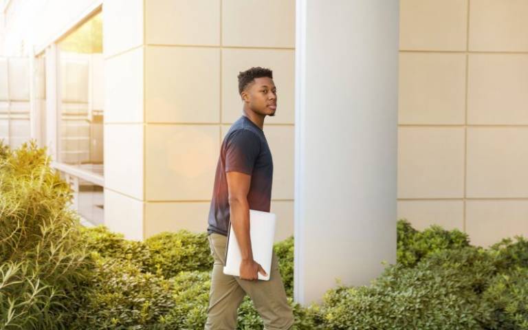 Man walking into university. Image: LinkedIn Sales Navigator via Pexels