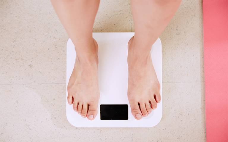 Person stood on weighing scales