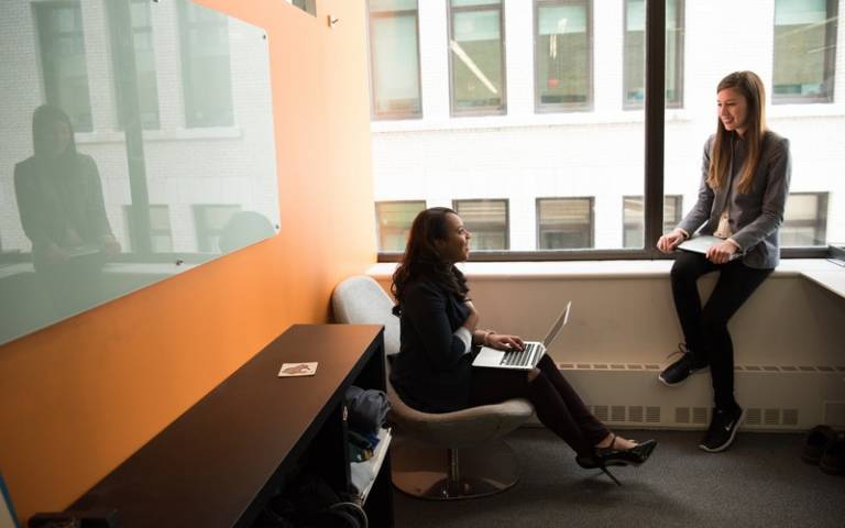 Two women sitting in the office. Image: Christina Morillo via Pexels