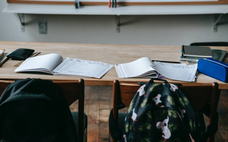 Workbooks and papers on classroom table. Image: Katerina Holmes via Pexels