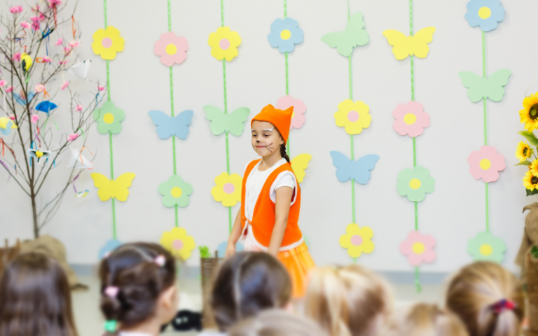 A young girl dressed like a fox performing in a school play. Image credit: Angelov via AdobeStock.