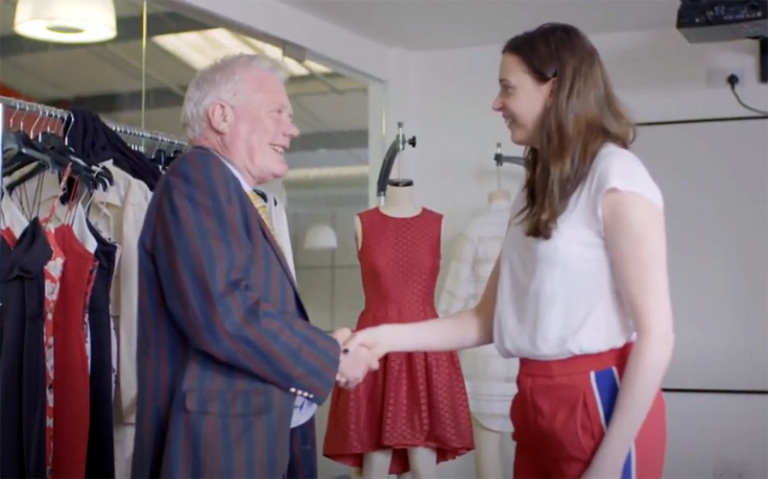 Paul Grainger shakes hands with Jenni Sutton, Development Director of Fashion Enter
