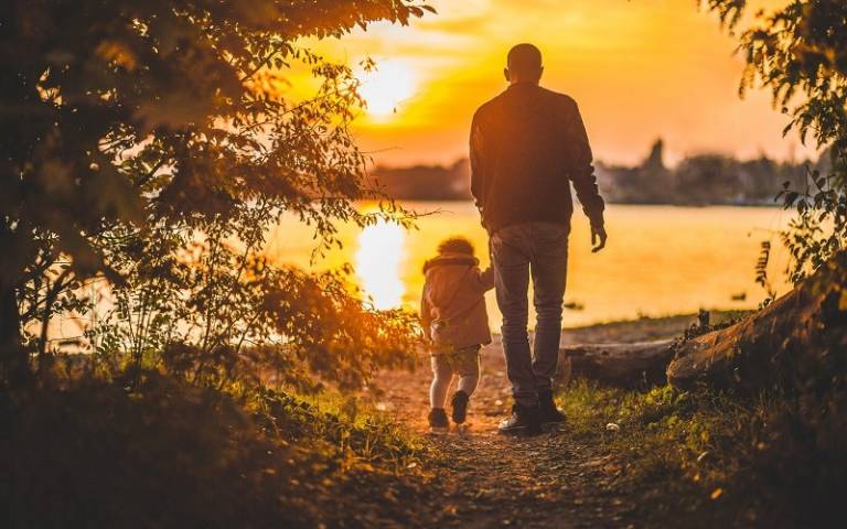 Father and daughter in sunset
