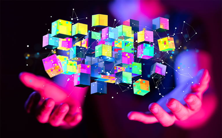 Colourful virtual reality cubes floating above a pair of hands palm-up. Image: Markus Glombitza / Adobe Stock