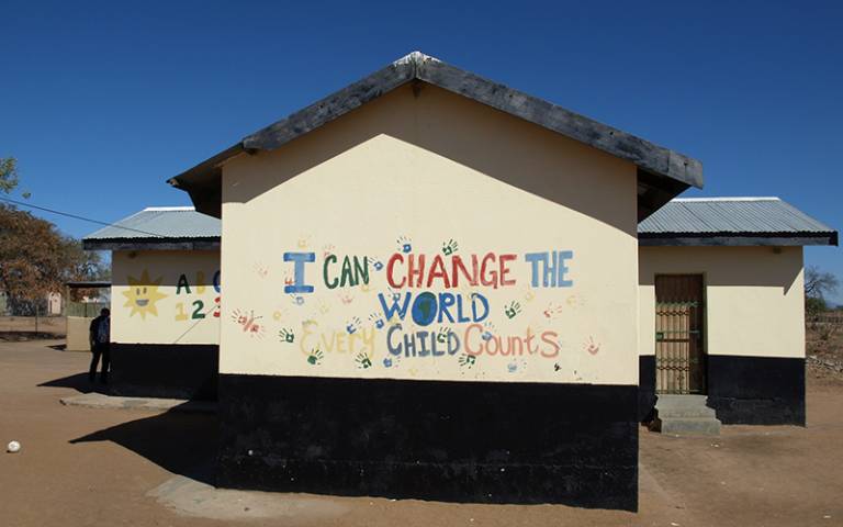 "I can change the world - every child counts" written on a school wall in an African country