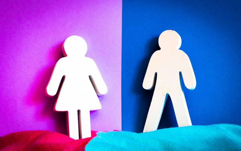 Man cutout on blue background and woman cutout on pink background