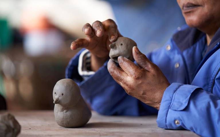 Person making clay bird. Image: Ben McDade and Maudsley Charity