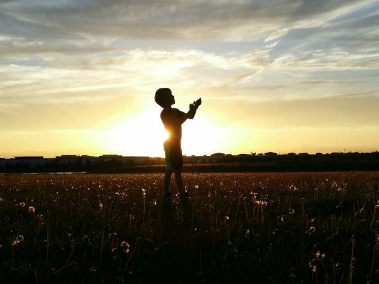Child standing in a field