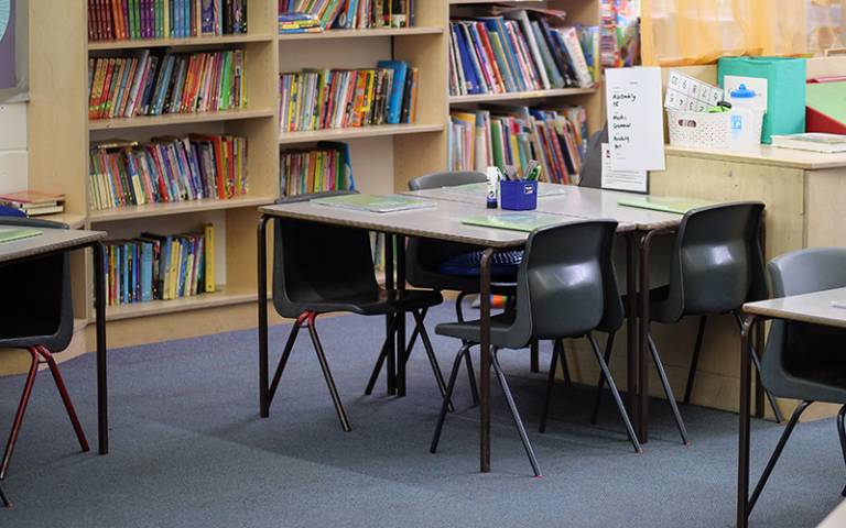 Chairs, tables, bookshelves in a primary school classroom