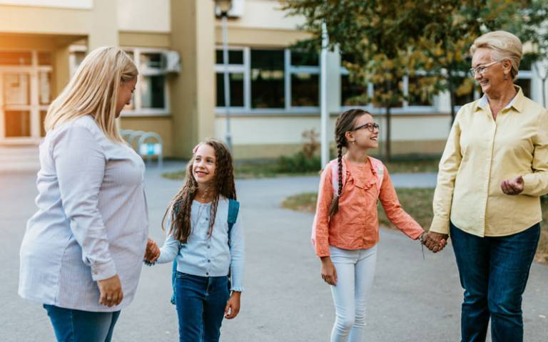 Parents come to pick up their children at school. Credit: hedgehog94 / Adobe Stock