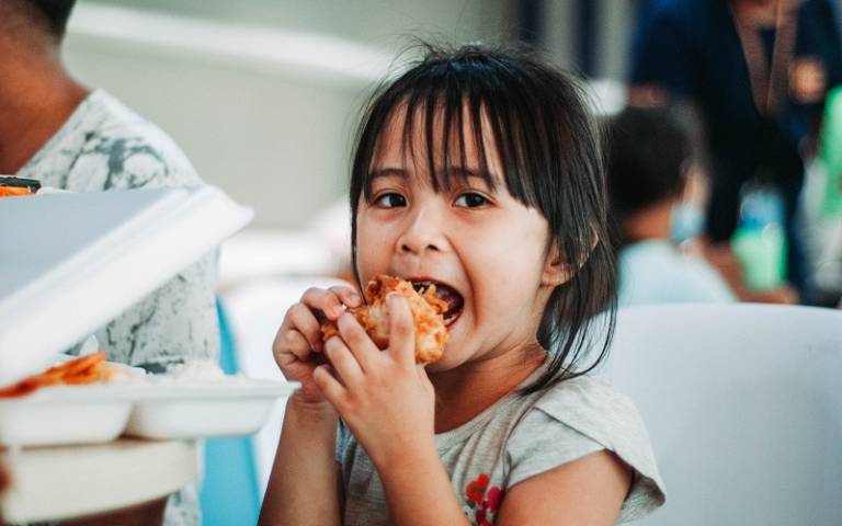 Small girl eating food