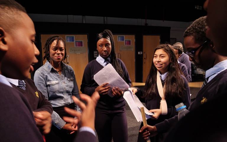 Teacher and pupils talking in a drama class
