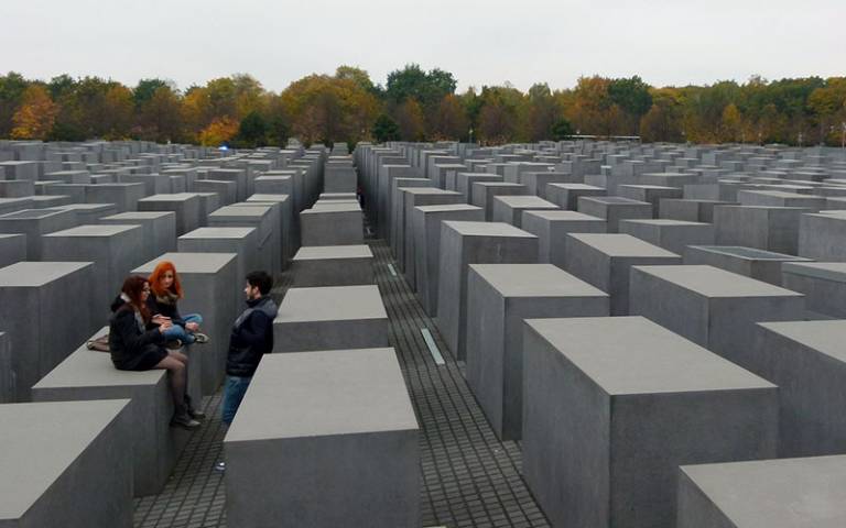 Teens sitting on the Berlin Holocaust memorial