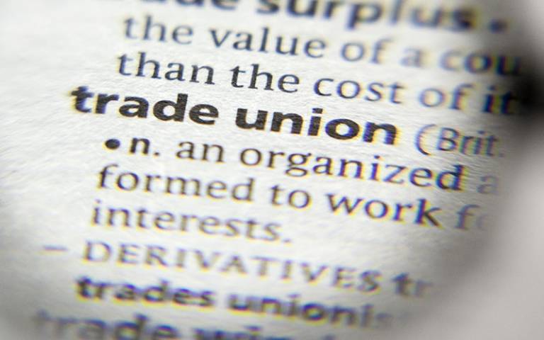 A close-up of the term 'trade union' in a dictionary (Photo: sharafmaksumov / Adobe Stock)