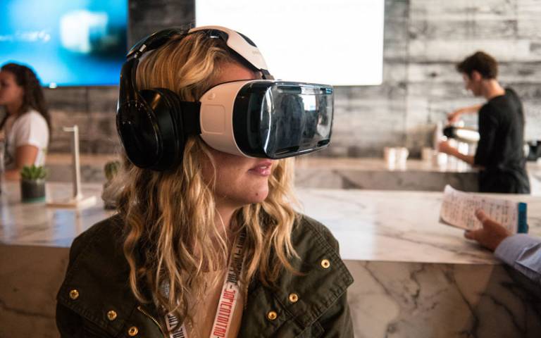Woman using a virtual reality headset. Image credit: Nan Palmero via Flickr (CC BY 2.0)