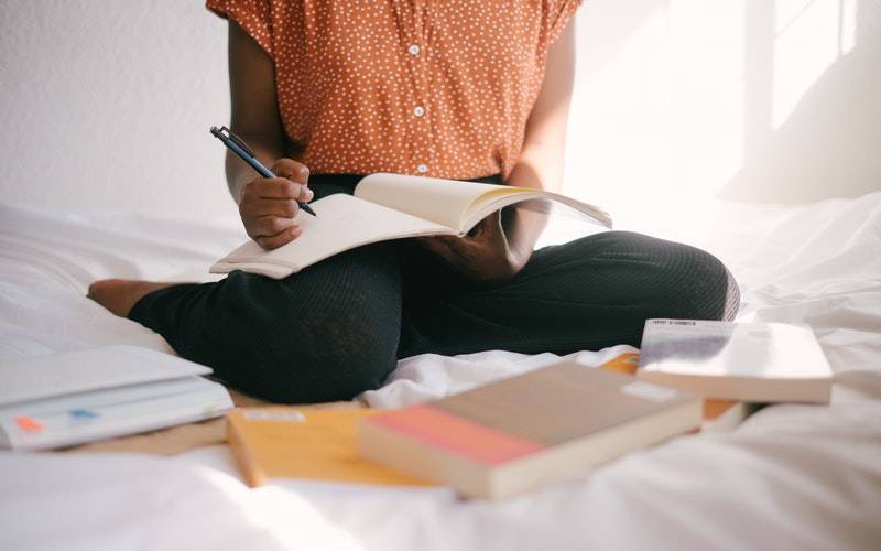 Student studying with books. Image: Retha Ferguson via Pexels