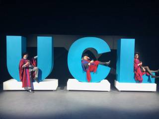 graduation ceremony with professors on UCL logo